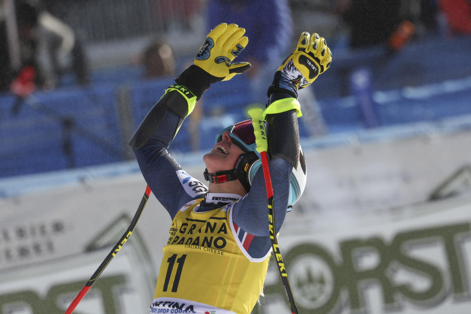 Norway's Ragnhild Mowinckel celebrates at the finish area of an alpine ski, women's World Cup super-G, in Cortina d'Ampezzo, Italy, Sunday, Jan. 22, 2023. (AP Photo/Alessandro Trovati)