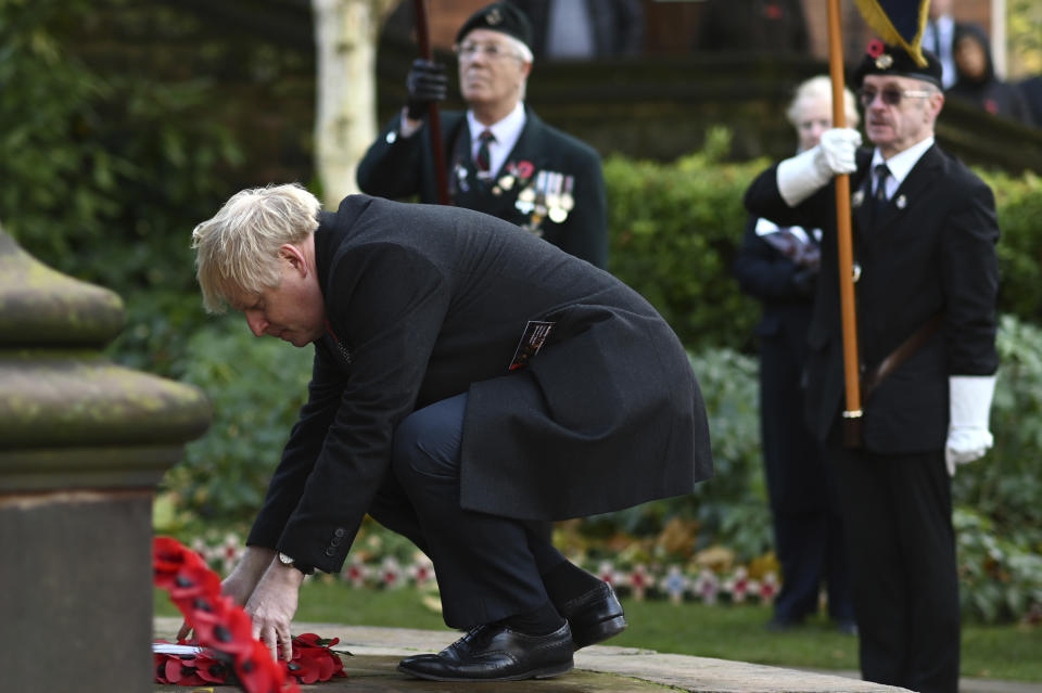 Britain's Prime Minister Boris Johnson lays a wreath as he attends a remembrance service on Armistice Day, the 101st anniversary of the end of the First World War, in Wolverhampton, England, Monday, Nov. 11, 2019, while on the General Election campaign trail. (Ben Stansall/Pool Photo via AP)