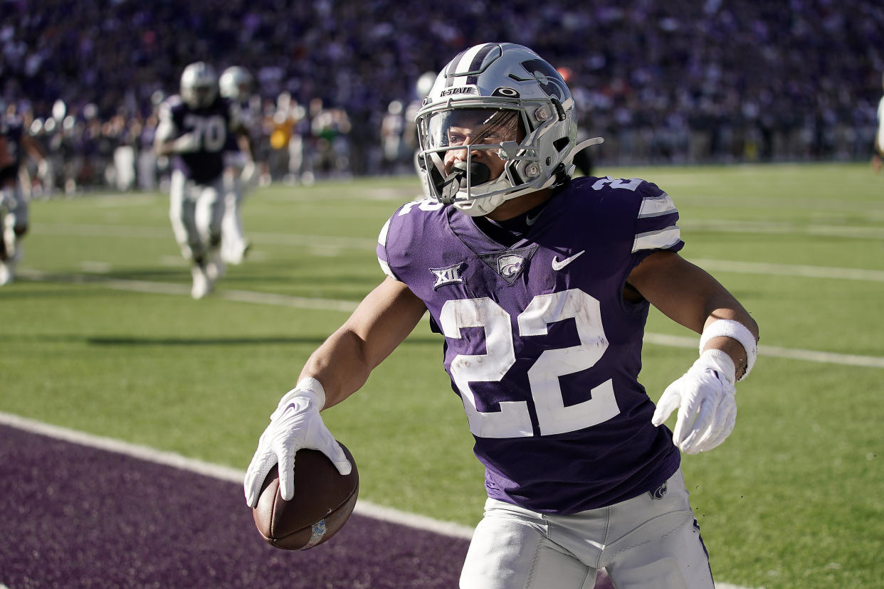 Kansas State running back Deuce Vaughn celebrates after scoring a touchdown during the first half of an NCAA college football game against Oklahoma State Saturday, Oct. 29, 2022, in Manhattan, Kan. (AP Photo/Charlie Riedel)
