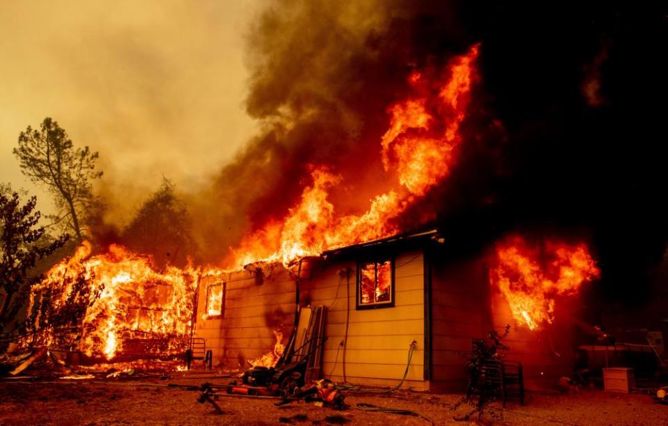 Firefighters battle the Fawn fire burning north of Redding in Shasta county last month.