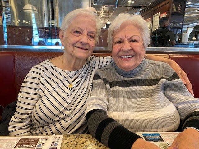 Vincenza Miller (left) and Maria Holzhauer (right) reuniting for the first time at Goshen Diner.