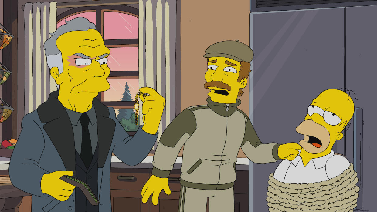 THE SIMPSONS: When a ruthless debt collector comes to Springfield, Homer and Ned's lives are sucked into the artfully violent world of prestige TV in part one of the “A Serious Flanders” episode of THE SIMPSONS airing Sunday, Nov. 7 (8:00-8:30 PM ET/PT) on FOX. Guest voices L-R: Brian Cox and Chris O’Dowd. THE SIMPSONS © 2021 by 20th Television.