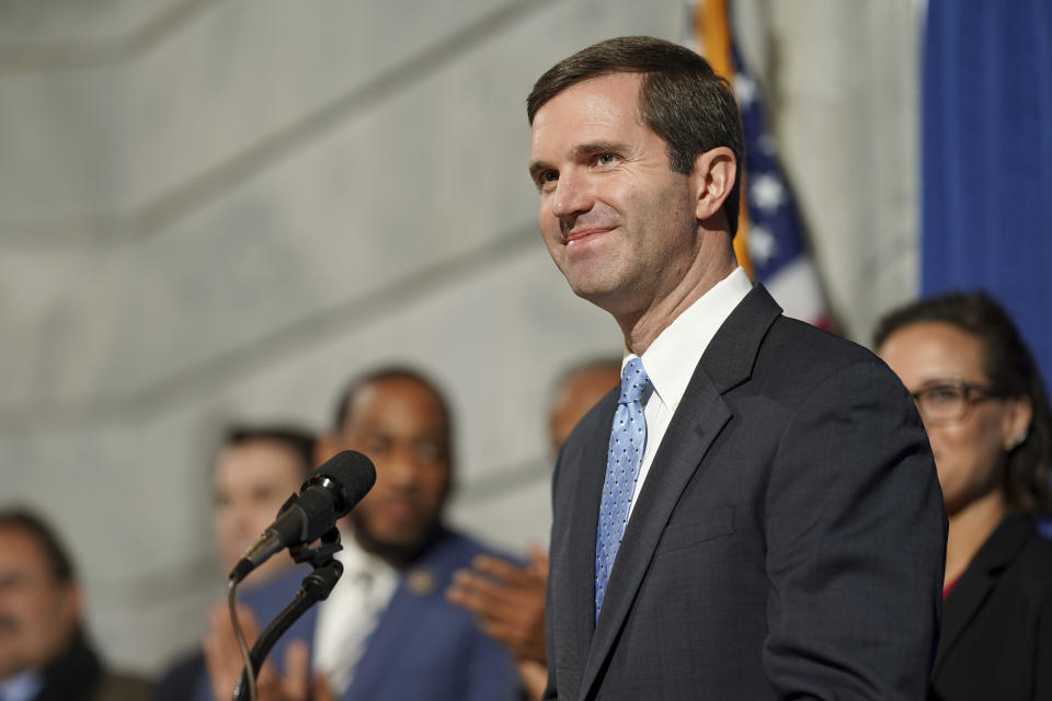 Kentucky Democratic Governor Andy Beshear speaks at a press conference before signing an executive order to reinstate the voting rights of over 100,000 non-violent felons who have completed their sentences, at the Capitol in Frankfort, Ky., Thursday, Dec. 12, 2019. (AP Photo/Bryan Woolston)