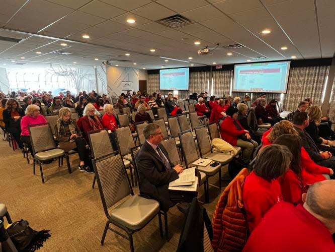 Audience members listen during testimony against the proposed South Dakota social studies standards during a hearing Friday, Feb. 10, 2023, at the Rushmore Hotel in Rapid City.