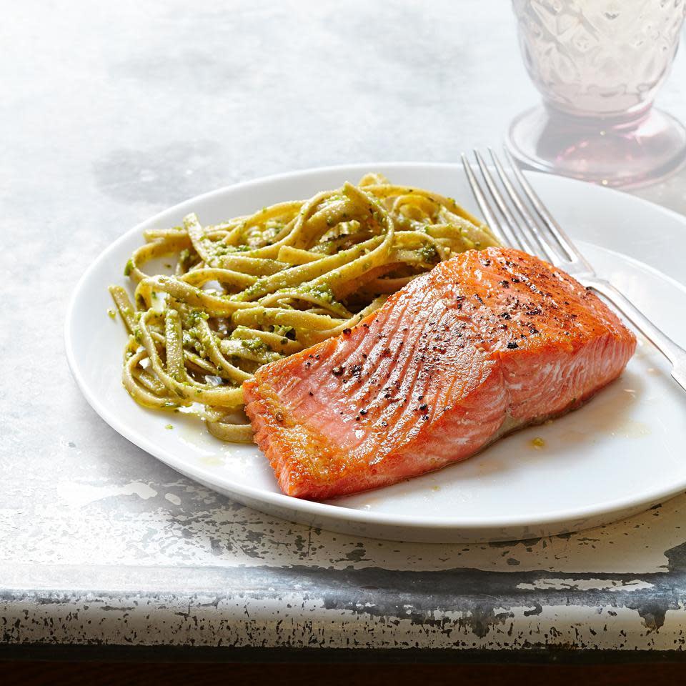 <p>The brightness of basil pesto is a nice match for the buttery flavor of salmon in this quick and healthy dinner recipe. Refrigerated pesto, found near fresh sauces and salsas at most stores, is prettier and has a better taste than jarred varieties.</p>