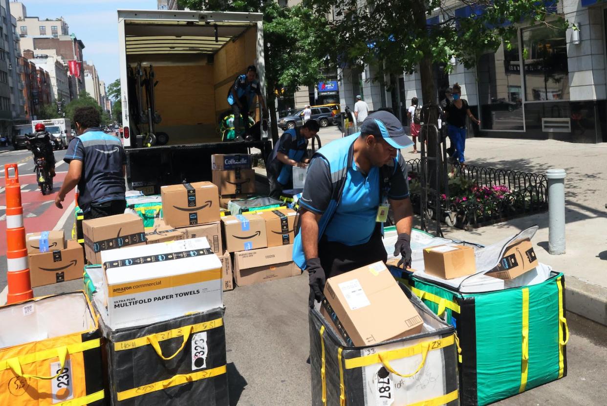 Amazon workers sort packages for delivery on East 14th Street in New York City, July 12, 2022. <a href="https://www.gettyimages.com/detail/news-photo/amazon-workers-sort-packages-for-delivery-on-e-14th-street-news-photo/1408261737" rel="nofollow noopener" target="_blank" data-ylk="slk:Michael M. Santiago/Getty Images;elm:context_link;itc:0;sec:content-canvas" class="link ">Michael M. Santiago/Getty Images</a>