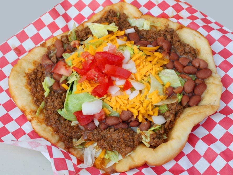 Navajo tacos with beans lettuce tomato and cheese