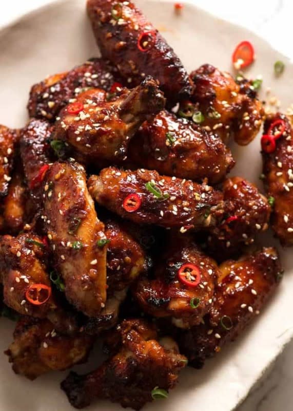 <p>RecipeTin Eats</p><p>Tossed in a savory, sweet, garlicky Asian marinade, then baked in the oven and basted until deeply golden and very, very sticky.</p><p><strong>Get the recipe: <a href="https://www.recipetineats.com/sticky-chinese-chicken-wings/" rel="nofollow noopener" target="_blank" data-ylk="slk:Sticky Baked Chinese Chicken Wings;elm:context_link;itc:0;sec:content-canvas" class="link rapid-noclick-resp">Sticky Baked Chinese Chicken Wings</a></strong></p>