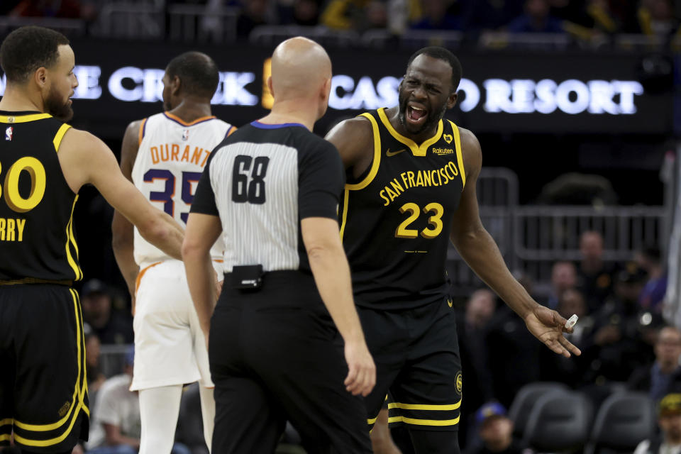 Golden State Warriors forward Draymond Green (23) argues with a referee after receiving a technical foul during the second half of an NBA basketball against the Phoenix Suns game in San Francisco, Saturday, Feb. 10, 2024. (AP Photo/Jed Jacobsohn)