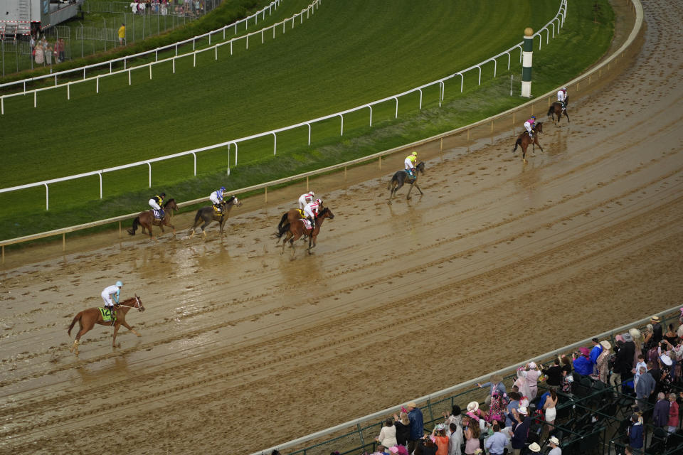 Horses run after leaving the starting gate at Churchill Downs during the 150th running of the Kentucky Oaks horse race Friday, May 3, 2024, in Louisville, Ky. (AP Photo/Charlie Riedel)