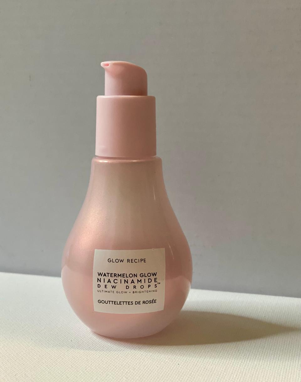 Glow Recipe Niacinamide Dew Drops in a pink pear-shaped bottle with a pump against a white background