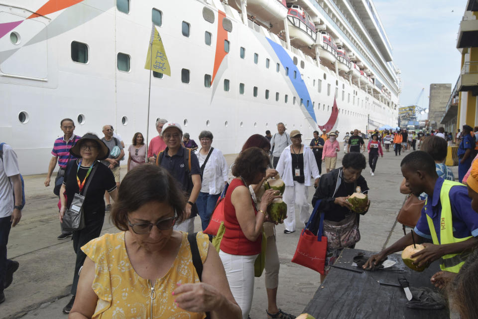 Some of the more than 2,000 tourists who were on board the MV Norwegian Dawn cruise ship are assisted to disembark soon after the ship docked at the port of Mombasa, Kenya, from Seychelles, Jan. 14, 2024. / Credit: Gideon Maundu/AP