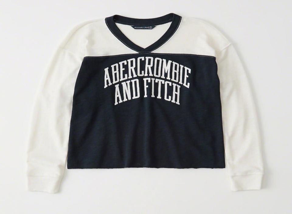 Long-sleeve blue and white t-shirt with Abercrombie and Fitch on it.