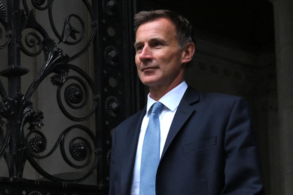 Britain's new Chancellor of the Exchequer Jeremy Hunt arrives in Downing Street in central London on October 14, 2022. - Newly appointed UK finance minister Jeremy Hunt is a mild-mannered political survivor who will require all of his considerable experience to calm an economy and government beset by chaos. (Photo by Daniel LEAL / AFP) (Photo by DANIEL LEAL/AFP via Getty Images)