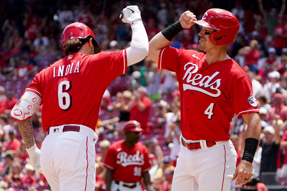 Cincinnati Reds second baseman Jonathan India (6) is congratulated by Cincinnati Reds shortstop Matt Reynolds (4) after hitting a two-run home run during the third inning of a baseball game, Sunday, July 10, 2022, at Great American Ball Park in Cincinnati.