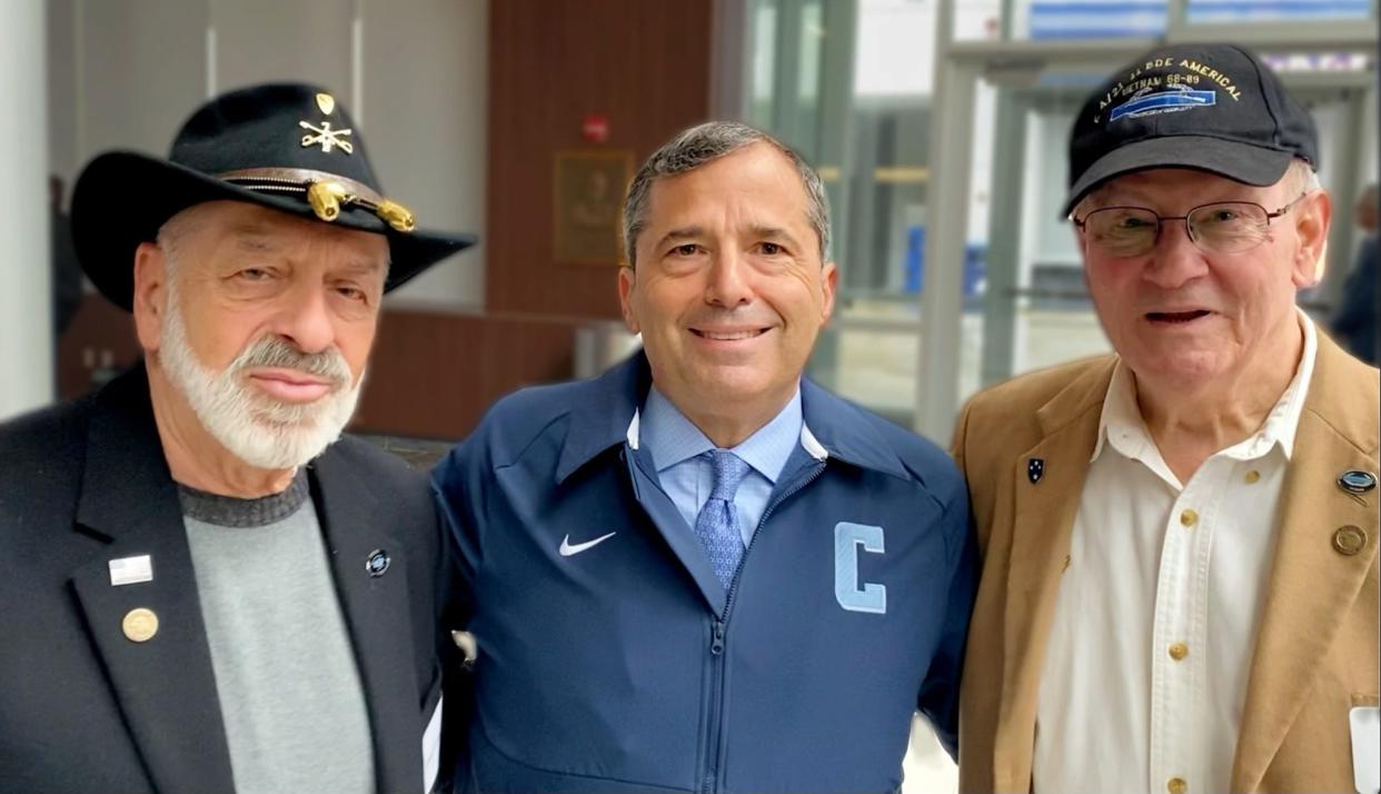 Joshua Kraft, center, president of the New England Patriots Foundation, is flanked by two Rhode island Vietnam vets after the March 28 pinning ceremony at Gillette Stadium. Both vets earned the Combat Infantryman Badge during that conflict. Bert Guarnieri, of North Providence, left, sports the 1st Cavalry Stetson. Jim D’Agostino, right, of West Greenwich, transferred to the Air Force after Vietnam and rose to the rank of brigadier general.