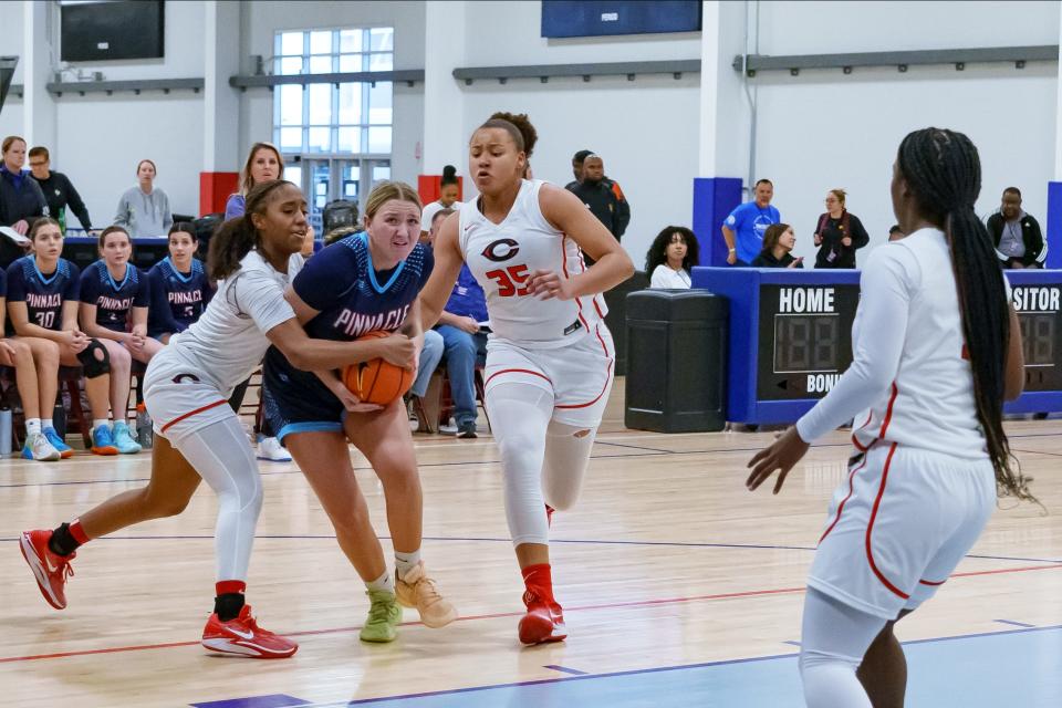 Mia Singstock (34) of Pinnacle High School pushes past Centennial players during a game at the Nike Tournament of Champions at Legacy Sports Park on Dec. 18, 2023, in Mesa.