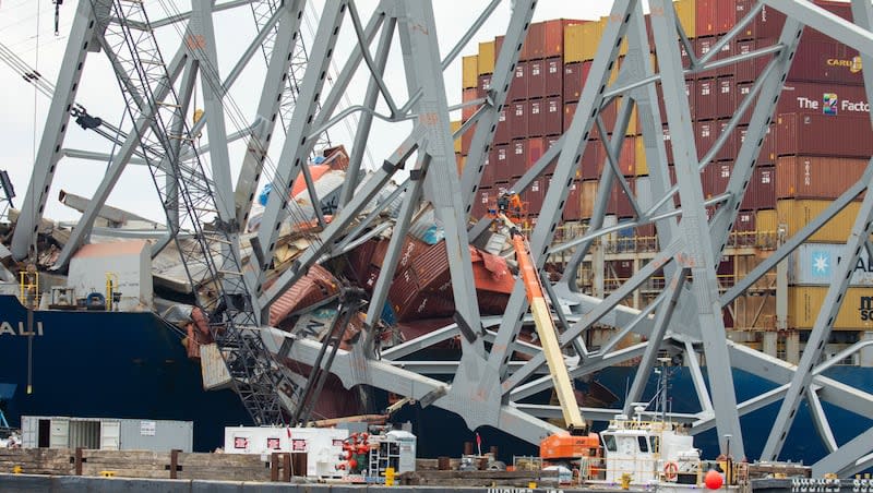 In this photo provided by the U.S. Army Corps of Engineers, salvors with the Unified Command prepare charges for upcoming precision cuts to remove Section 4 from the port side of the bow of the Dali container ship, May 7, 2024, during the Key Bridge Response, in Baltimore. Debris and wreckage removal is ongoing in support of safely and efficiently opening the Fort McHenry Channel, following the Francis Scott Key Bridge’s March 26 collapse.