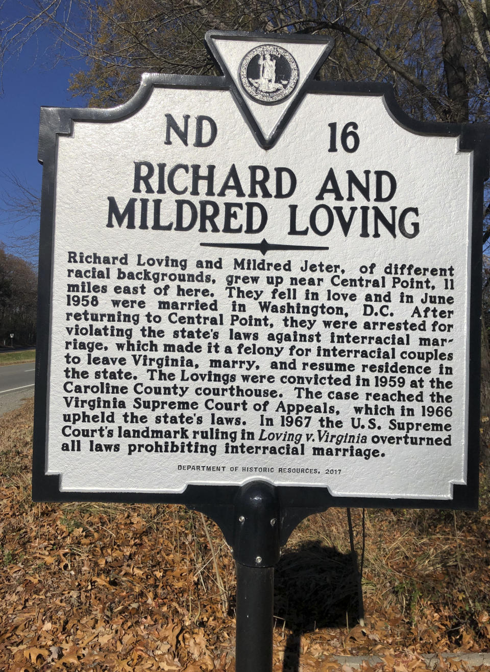 A highway marker stands for Richard and Mildred Loving on Thursday, Dec. 1, 2022, in Milford, Va. The interracial couple's legal challenge led to a 1967 U.S. Supreme Court ruling that struck down state laws banning marriages between people of different races. The Respect for Marriage Act enshrines interracial and same-sex marriages in federal law. (AP Photo/Denise Lavoie)