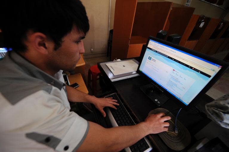 An Afghan resident uses a computer to access Twitter in Kabul on May 15, 2011