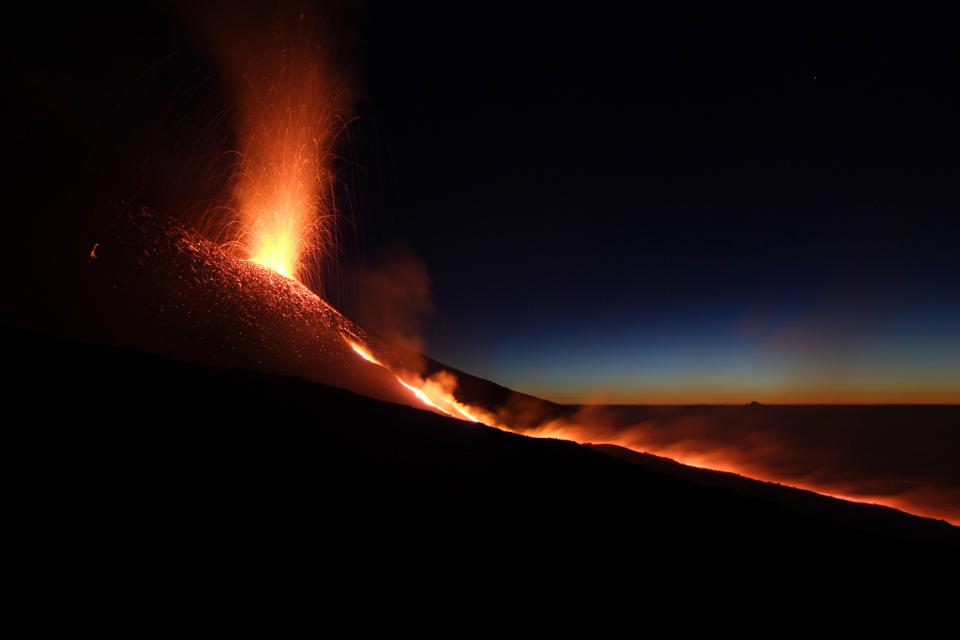 Mount Etna spews lava on the southern Italian island of Sicily, in the early hours of July 17, 2006. The volcano has been erupting since Saturday, local media reported. REUTERS/Antonio Parrinello (ITALY)