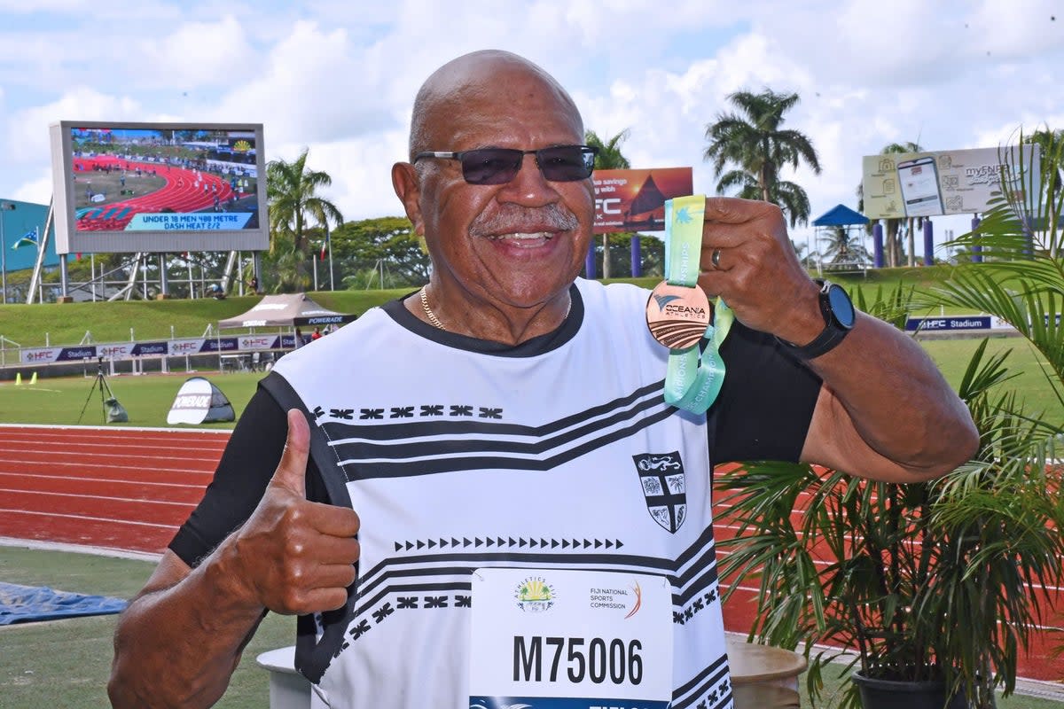 Fiji prime minister Sitiveni Rabuka hold his bronze medal at the Oceania athletics championships (Sitiveni Rabuka Facebook)