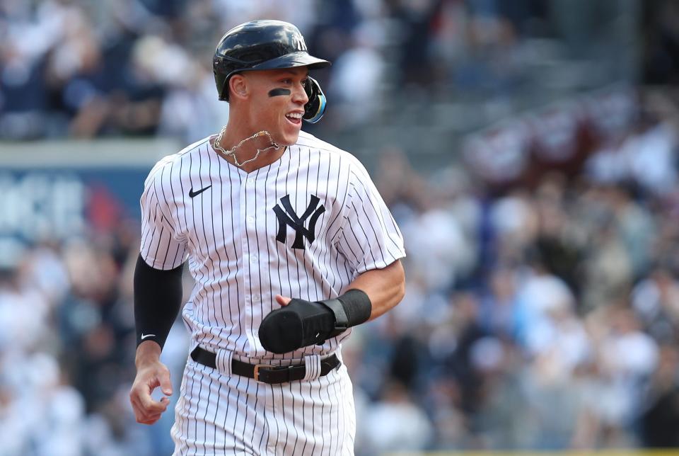 Aaron Judge is all smiles as he rounds the bases on Anthony Rizzo's two-run homer during the Yankees' Opening Day victory over the Boston Red Sox.