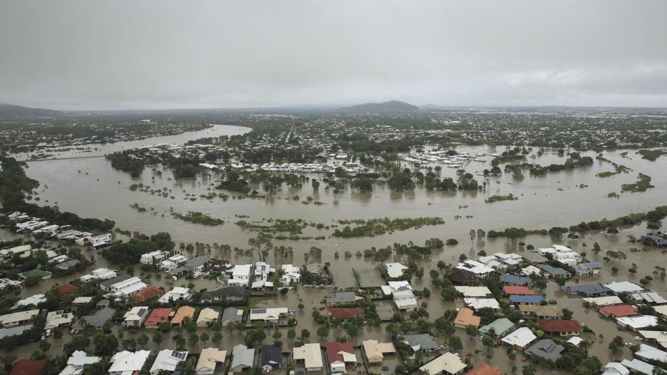 Townsville flooding: Two men missing as thousands evacuate