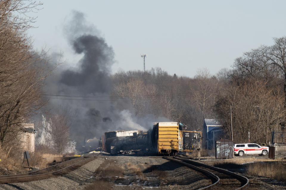 Smoke rises from a derailed cargo train in East Palestine, Ohio, on February 4, 2023. - The train accident sparked a massive fire and evacuation orders, officials and reports said Saturday. No injuries or fatalities were reported after the 50-car train came off the tracks late February 3 near the Ohio-Pennsylvania state border. The train was shipping cargo from Madison, Illinois, to Conway, Pennsylvania, when it derailed in East Palestine, Ohio. (Photo by DUSTIN FRANZ / AFP) (Photo by DUSTIN FRANZ/AFP via Getty Images)