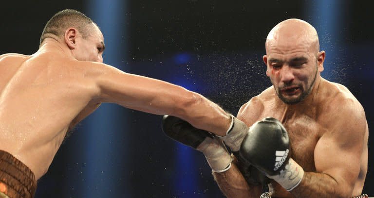 Armenian-German super middleweight boxer Arthur Abraham (L) punches French challenger Mehdi Bouadla during the WBO Super-middleweight title boxing match in Nuremberg, southern Germany on December 15, 2012. Abraham won the fight in the 8th round