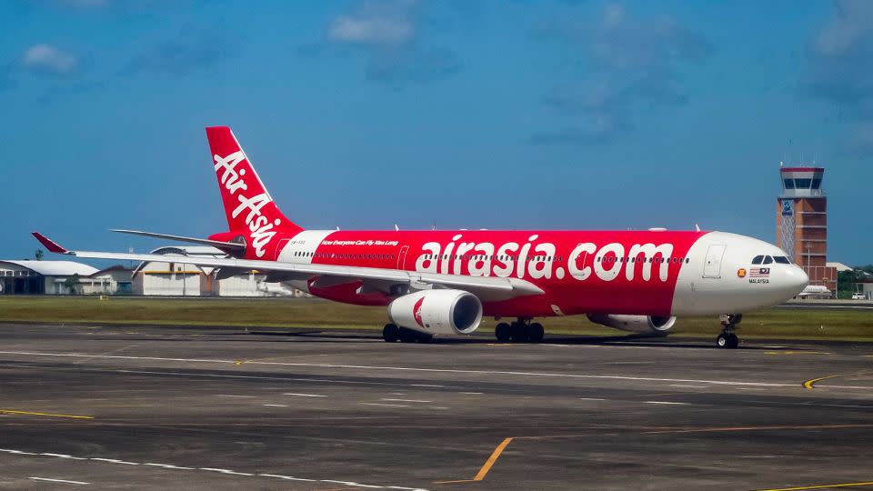 An Airasia passenger plane prepares for take-off at the I Gusti Ngurah Rai International Airport in Denpasar on Indonesia's resort island of Bali on May 13, 2023. (Photo by BAY ISMOYO / AFP) (Photo by BAY ISMOYO/AFP via Getty Images) - Bay Ismoyo/AFP/Getty Images