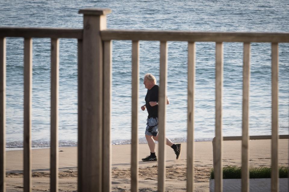 Boris Johnson going for a run at the G7 Summit (PA Wire)