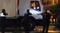 FILE - Police shine a light into the cab as they approach the driver's cab of a truck, in Nice, France, late Thursday July 14, 2016. Eight people go on trial Monday Sept.5, 2022 in a special French terrorism court for alleged roles in helping the attacker who drove a truck into the Nice beachfront on Bastille Day 2016, killing 86 people. (NADER EL SHAFEI via AP) MANDATORY CRED
