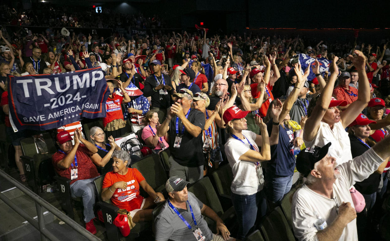 People react to the speech of Charlie Kirk, founder and president of Turning Point USA, during the Turning Point Action event at the Arizona Federal Theatre in Phoenix on July 24, 2021. The organization's America Fest 2021 comes to Phoenix later this month.