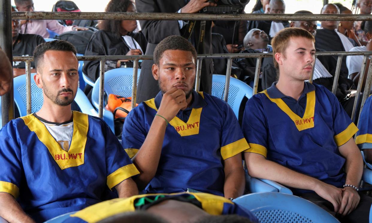 <span>(L-r) Benjamin Zalman-Polun, Marcel Malanga and Tyler Thompson Jr awaiting verdicts in their trial in Kinshasa on Friday.</span><span>Photograph: Justin Makangara/Reuters</span>