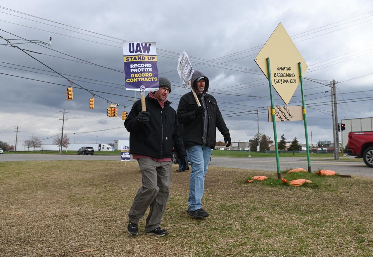 UAW Local 602 members picket near Millett Highway and Creyts Road Monday, Oct. 30, 2023.