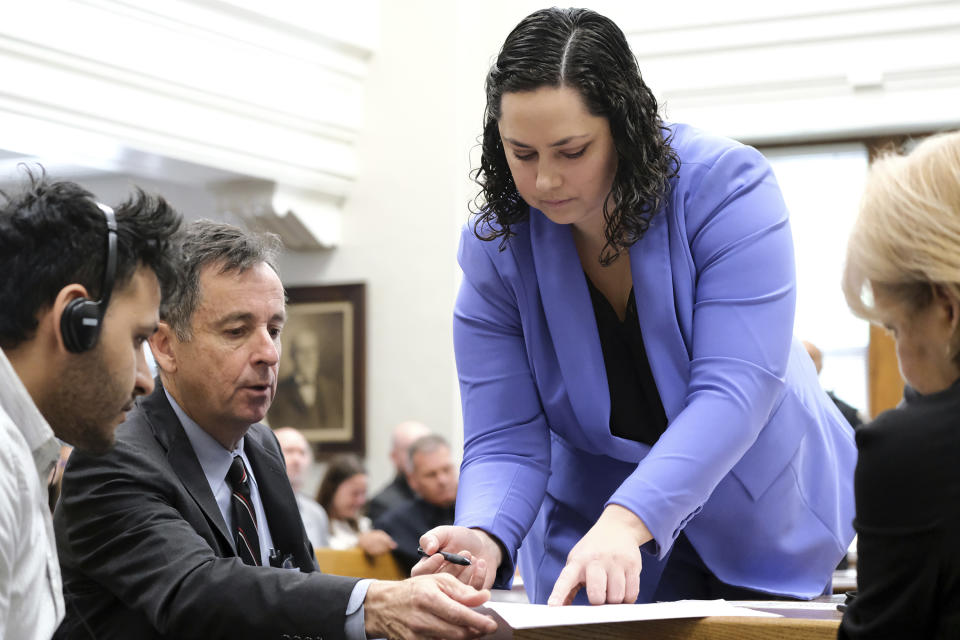 Defense attorneys Kaitlyn Beck and John Donnelly present the not guilty plea for Jose Ibarra to sign during Ibarra's court appearance on Friday, May 31, 2024, in Athens, Ga. Ibarra is accused of killing a nursing student whose body was found on the University of Georgia campus. (Nell Carroll/Atlanta Journal-Constitution via AP, Pool)