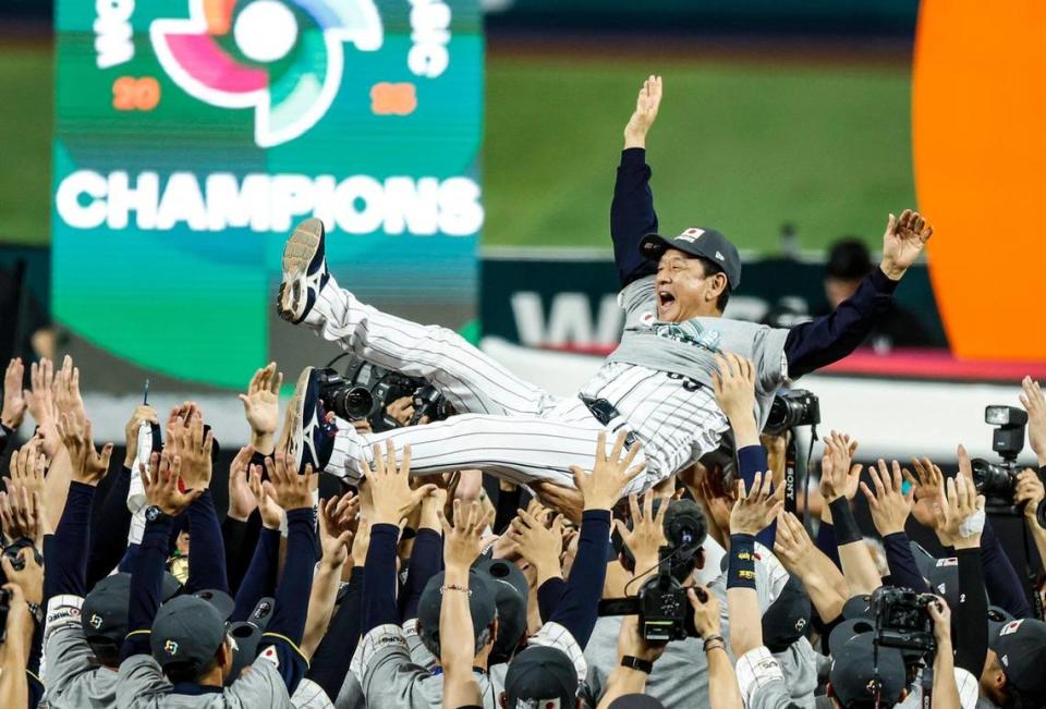 Japan manager Hideki Kuriyama (89) is tossed in the air after Japan defeats the United States during the World Baseball Classic Championship Game at loanDepot Park in Miami, Fla. on Tuesday, March 21, 2023.