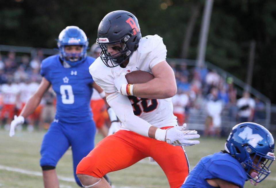 Rochester's Lance Ingold shakes off a tackler during a Central State Eight Conference football game against Decatur MacArthur at Stephen Decatur Middle School's athletic field on Friday, Sept. 8, 2023.