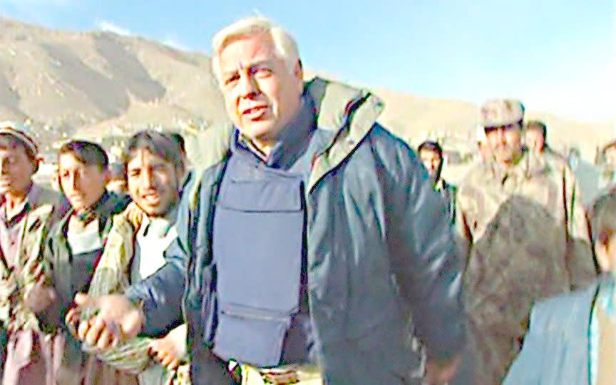 Simpson walks into Kabul during the fall of the Taliban in 2001