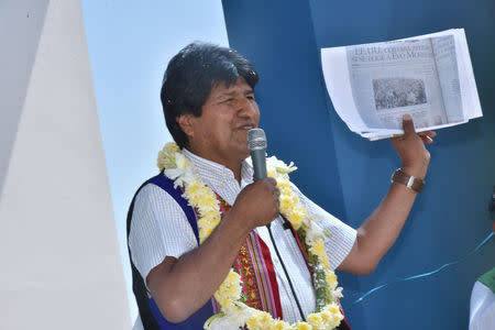 Bolivia's President Evo Morales speaks during a ceremony in Cochabamba, Bolivia, November 30, 2017. Newspaper Reads "US will cut aid if Evo Morales is elected". Enzo De Luca/Courtesy of Bolivian Presidency/Handout via REUTERS