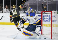 Vegas Golden Knights center Jonathan Marchessault (81) celebrates after scoring the game-winning goal against St. Louis Blues goaltender Jordan Binnington (50) during overtime of an NHL hockey game Friday, May 7, 2021, in Las Vegas. (AP Photo/John Locher)