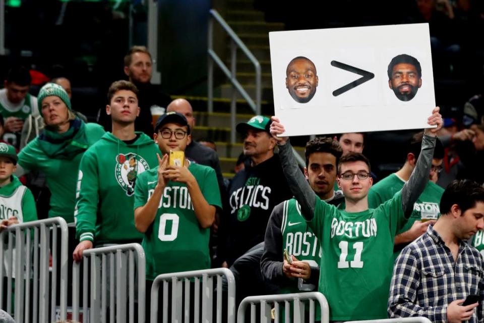 <div class="inline-image__caption"><p>A fan holds a sign with photos of Kyrie Irving and Kemba Walker before the game between the Boston Celtics and the Brooklyn Nets at TD Garden on November 27, 2019, in Boston, Massachusetts. </p></div> <div class="inline-image__credit">Maddie Meyer/Getty</div>