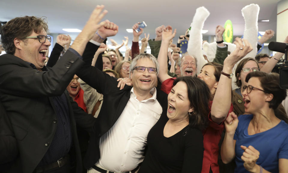 Green party chairwoman Annalena Baerbock and EU parliament member Sven Giegold celebrate after the first results in Berlin, Germany, Sunday, May 26, 2019. (Kay Nietfeld/dpa via AP)