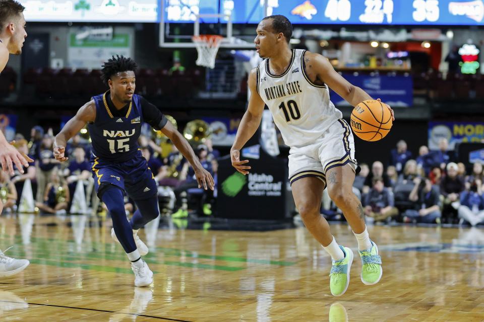 Montana State guard Darius Brown II (10) sets up the offense in front of Northern Arizona guard Jalen Cone (15) in Boise, Idaho. Montana State won 85-78. Brown is a grad transfer for the Utah State Aggies this season. | Steve Conner, Associated Press