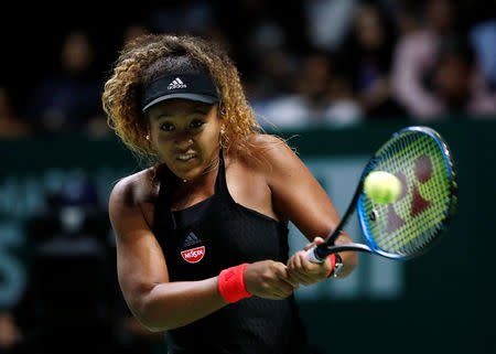 Tennis - WTA Tour Finals - Singapore Indoor Stadium, Kallang, Singapore - October 22, 2018 Japan's Naomi Osaka in action during her group stage match against Sloane Stephens of the U.S. REUTERS/Edgar Su