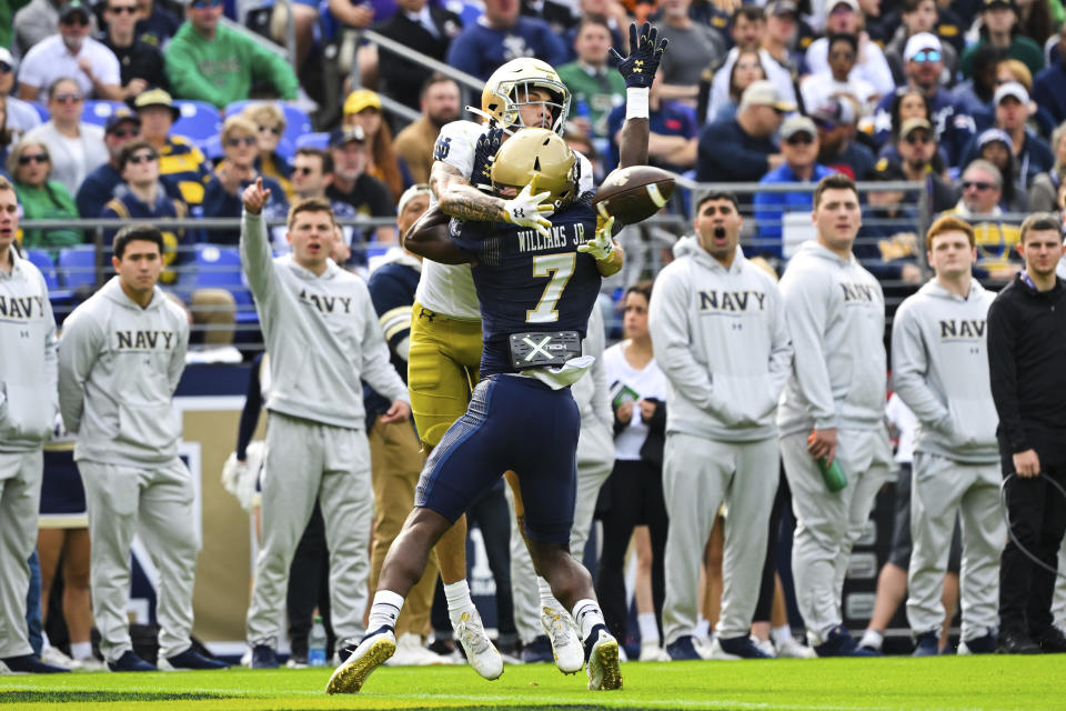 Notre Dame wide receiver Braden Lenzy catches the ball against Navy cornerback Mbiti Williams Jr. (7) for a touchdown during the first half of an NCAA college football game, Saturday, Nov. 12, 2022, in Baltimore. (AP Photo/Terrance Williams)