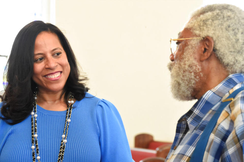 State Sen. Mia McLeod stands inside Shiloh Baptist Church as she talks with the Rev. Coley Mearite in Bennettsville, South Carolina. 