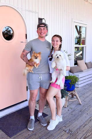 Baylen Dupree/ Instagram Baylen Dupree and boyfriend Colin Dooley with their dogs in June 2023 in the Outer Banks, N.C.