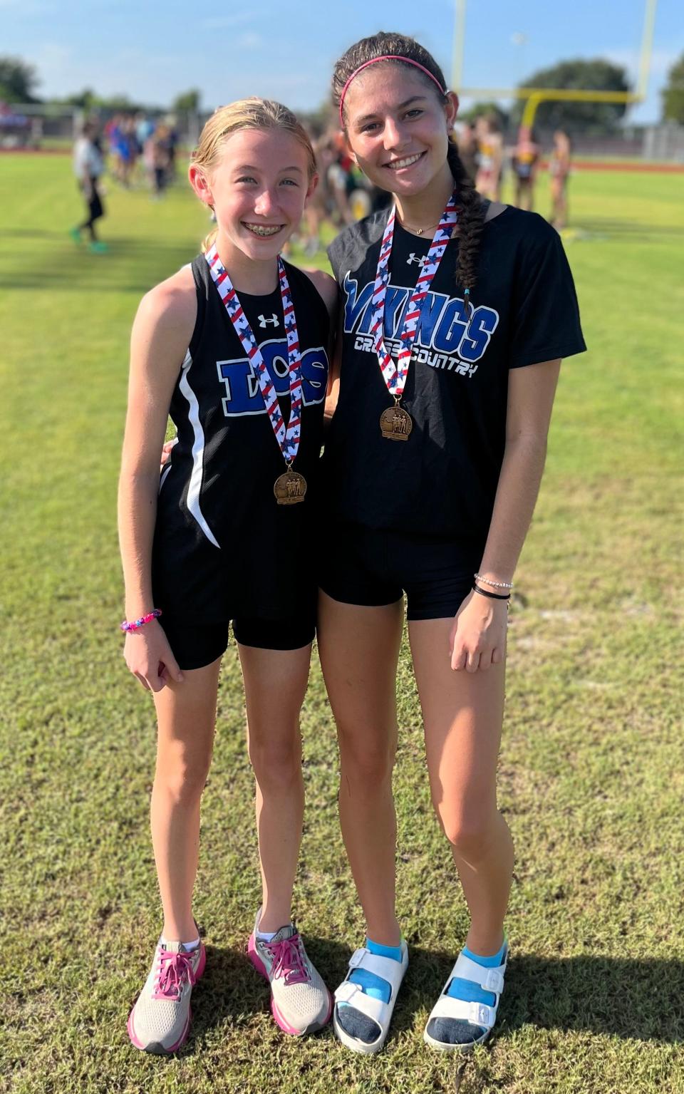 Lakeland Christian's Emma Wilkinson, left, and Sarah Bayes, right finished eighth and 13th respectively as the Vikings' top two finishers at the St. Cloud Invitational.